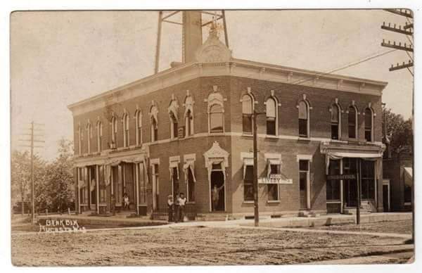 The old bank building with water tower visible behind. Currently, the public library.